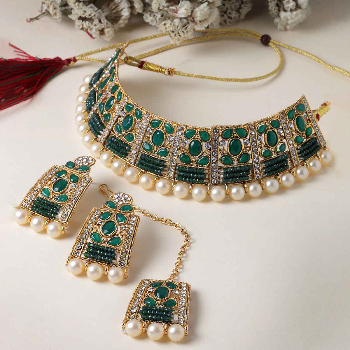Sukkhi Striking Gold Plated Green Stone Studded Choker Necklace Set
