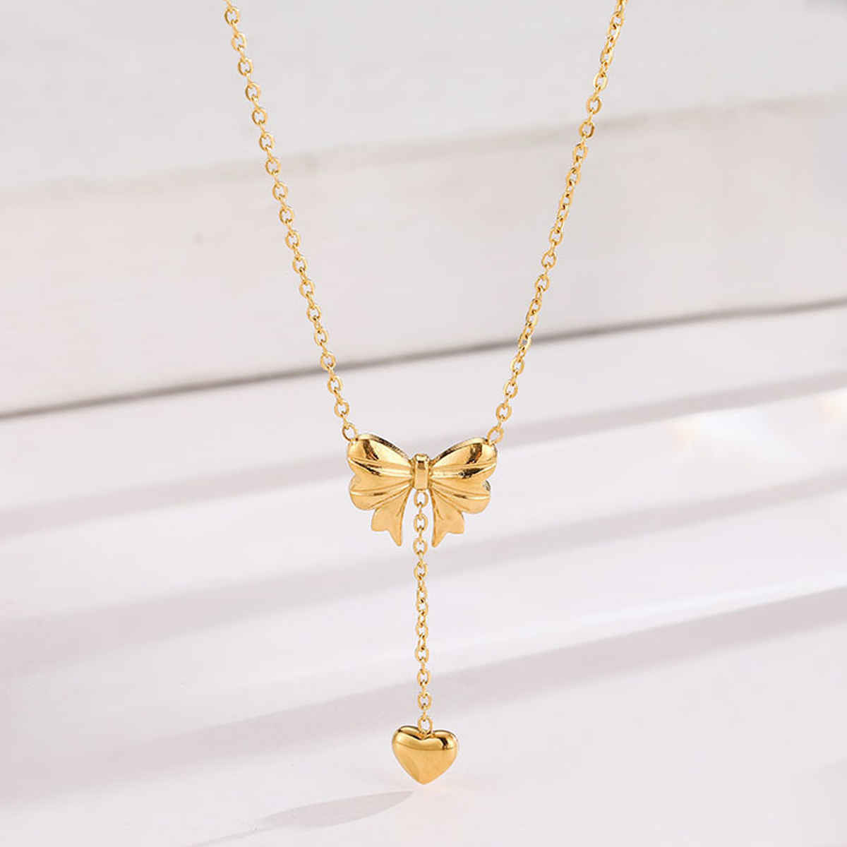 LabelShe Gold Plated Stainless Steel Heart Themed Bow Inspired Necklace | LS-NCK-67028