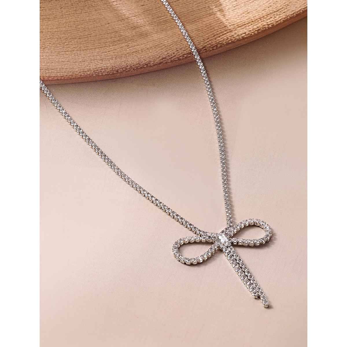 Rubans Rhodium Plated AD and Cubic Zirconia Studded Bow Design Statement Necklace