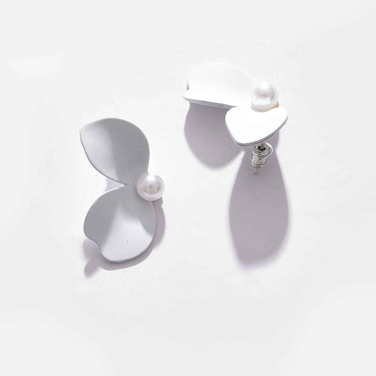 Sohi White Contemporary Studs Earrings