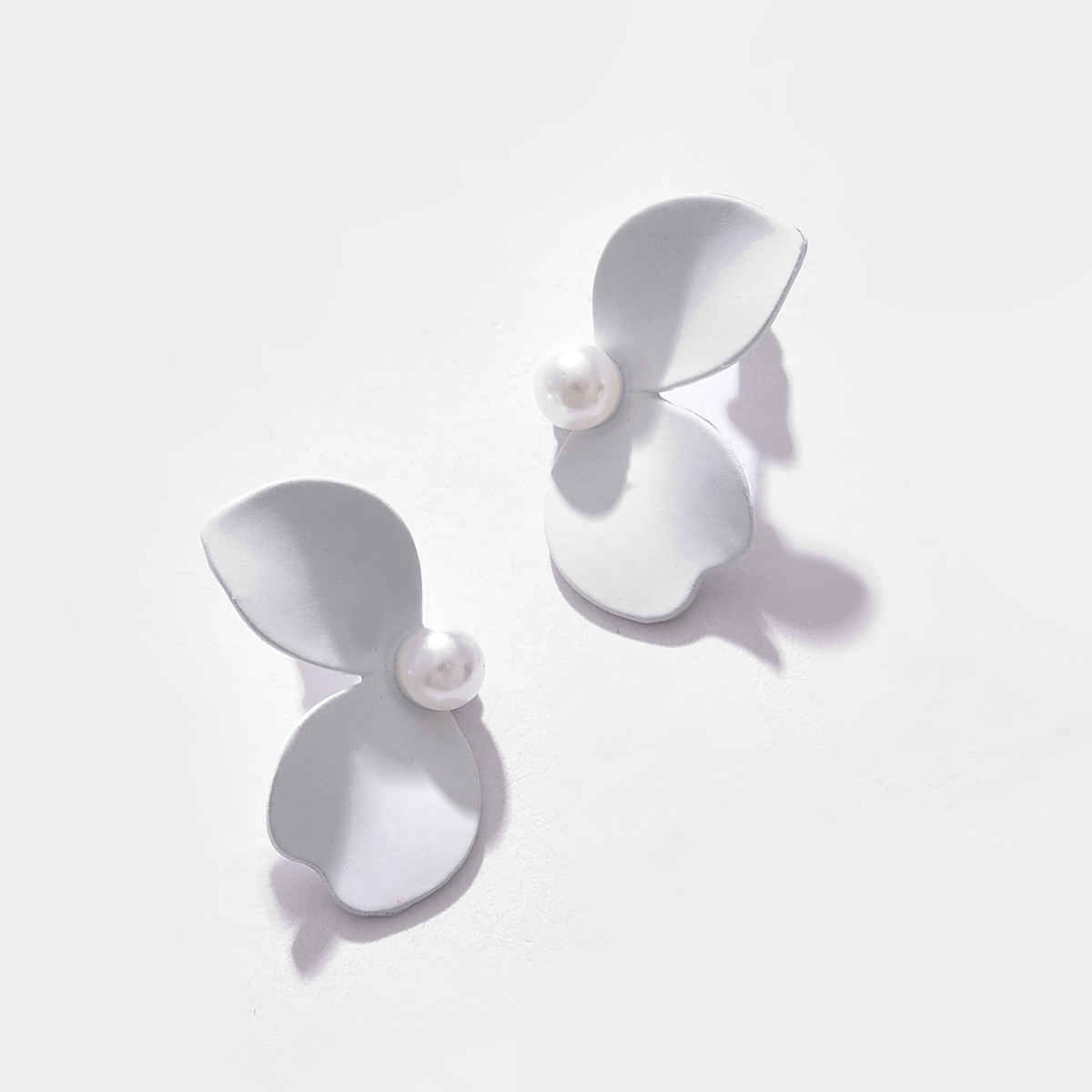 Sohi White Contemporary Studs Earrings