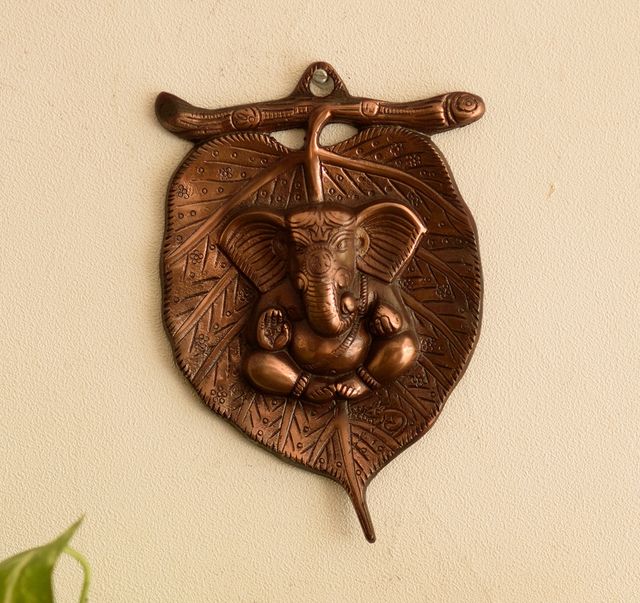 Buy eCraftIndia Brown Metal Lord Ganesha On Leaf Wall Hanging Online ...