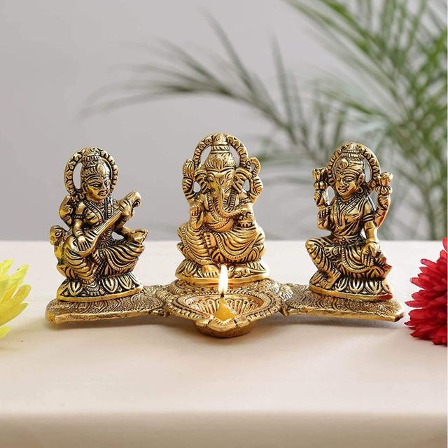 Devnidhii Diya Laxmi, Ganesh, Saraswati on Banana Leaves in Gold Polish