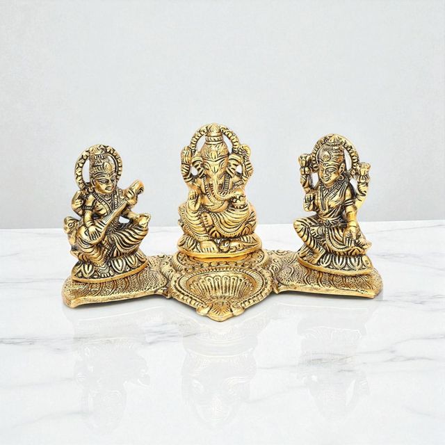 Devnidhii Diya Laxmi, Ganesh, Saraswati on Banana Leaves in Gold Polish