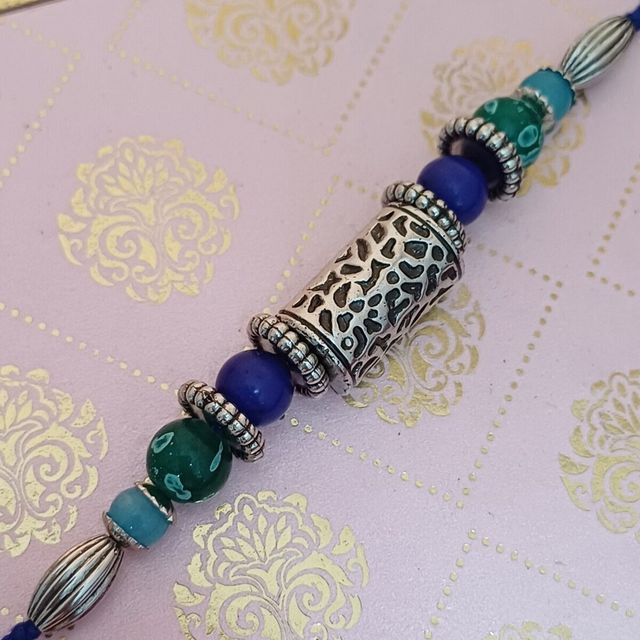 Gullak Antique Silver Taveej Rakhi - Cutwork