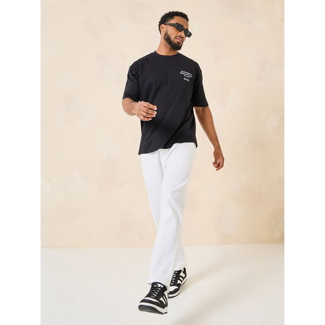 Styli Men's Oversized Fit Tee with Breakfast Graphic in Compact Cotton Jersey | Black - S