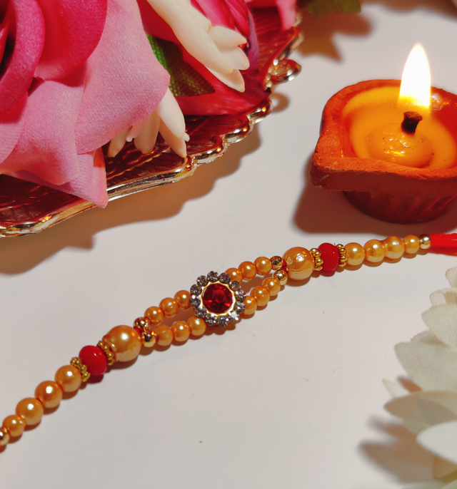 House Of Festivals Mauli Rakhi With Red Sparkling Stones & Moti