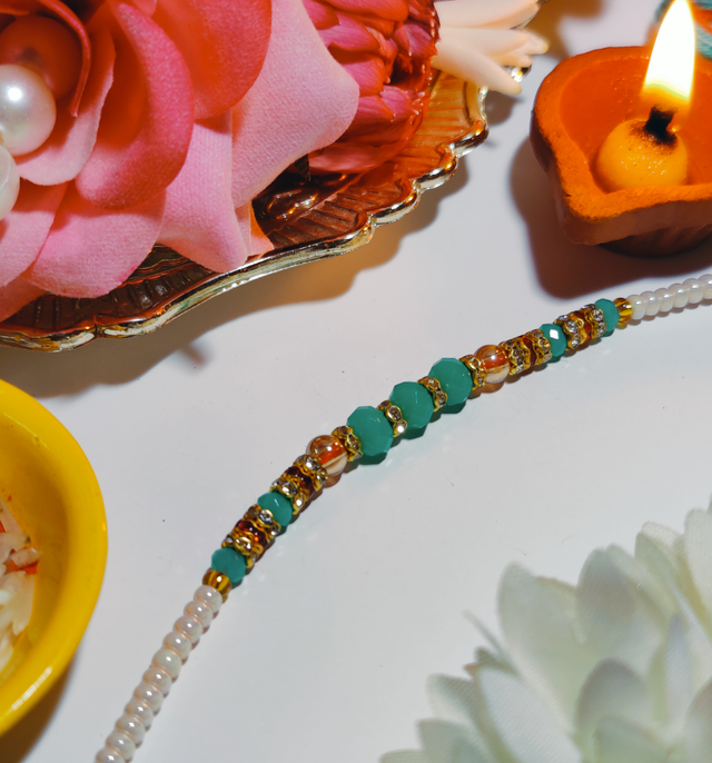 Snickers Miniatures Peanut Chocolate Bar(180gms) & Beautifully Weaved Moti Rakhi In Pastle Green & White Color(1pc) Combo
