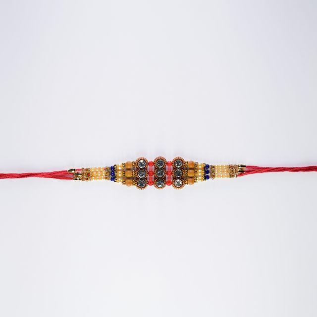 Cadbury Chocobakes Choclayered Cakes(114gms) & Aurum Premium Big Rakhi With Diamond & Bead Bracelet(1pc) Combo