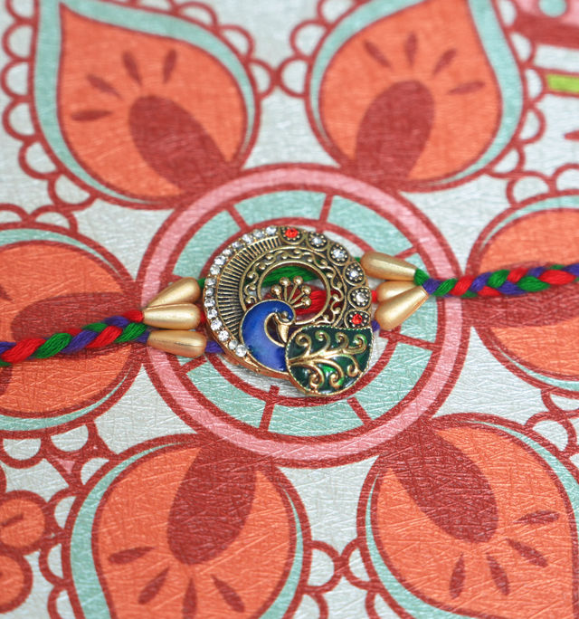 Aurum Peacock Rakhi With Decorative Meenakari