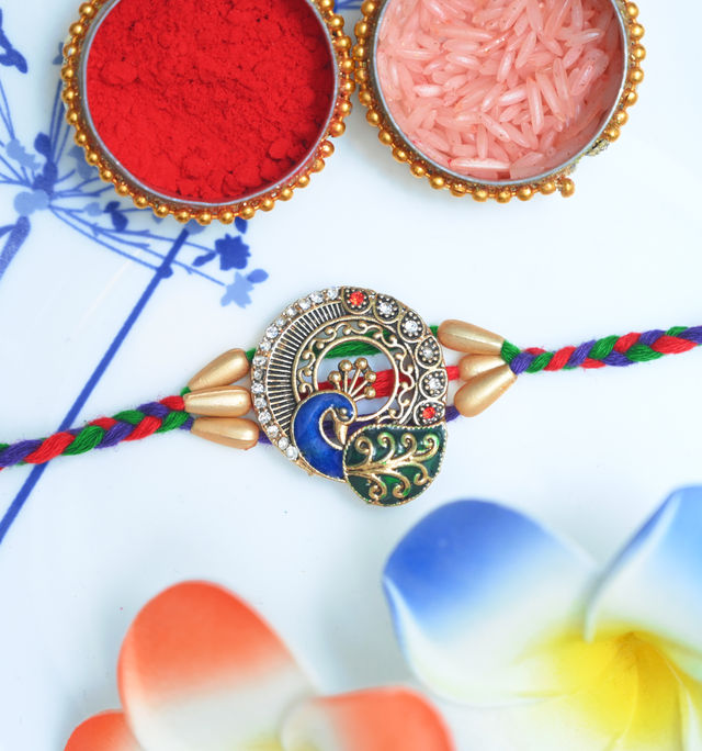 Aurum Peacock Rakhi With Decorative Meenakari