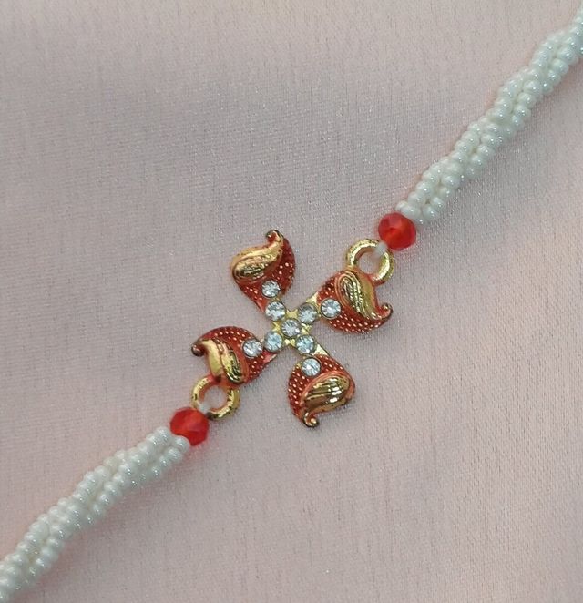 Gits Gulab Jamun Open & Eat (Tin)(1kg) & Gold Metal Swastik In Minakari With Twisted 3 Line Moti Rakhi For Brother(1pc) Combo