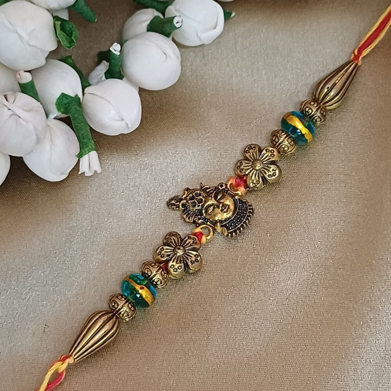 Gullak Krishna Flower Pendant Rakhi - Antique Gold