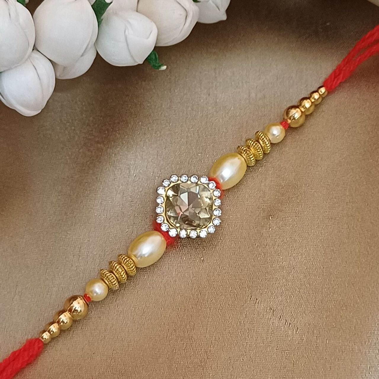 Gullak Gold Multicolour Crystal Rakhi - Elegant and Sparkling