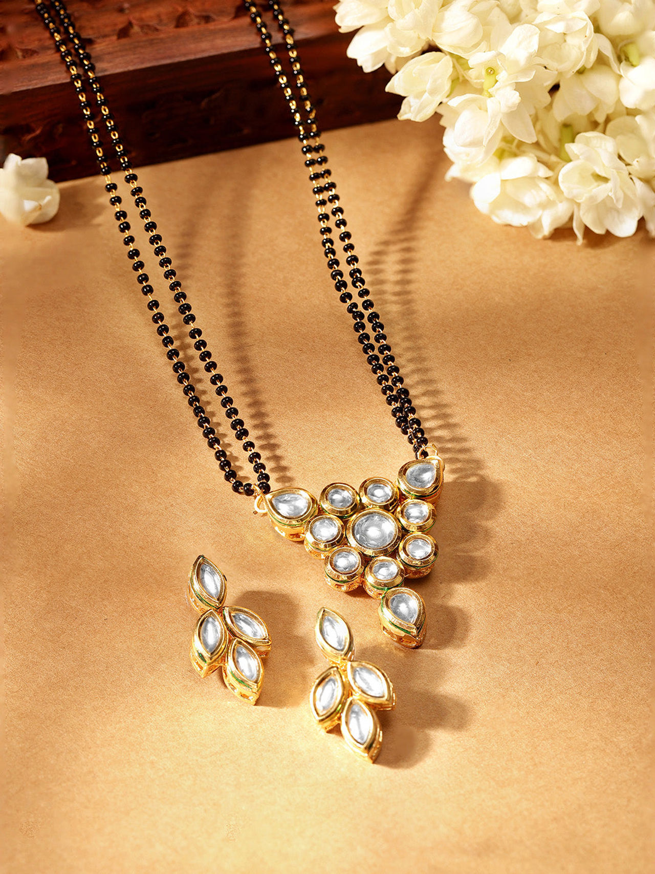 Priyaasi Floral Kundan Pendant Withmini Leaf Design Kundan Earrings Gold Plated Manglasutra Set