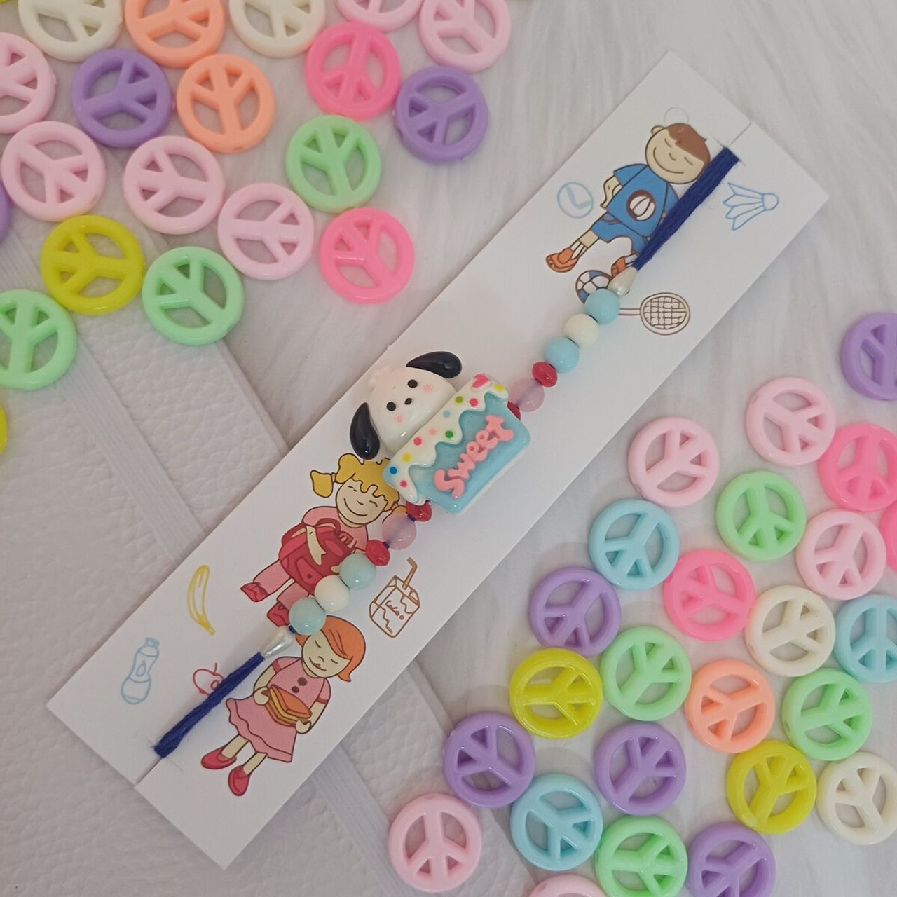Gullak Puppy On Cake Blue White Kids Rakhi - Fun and Colorful