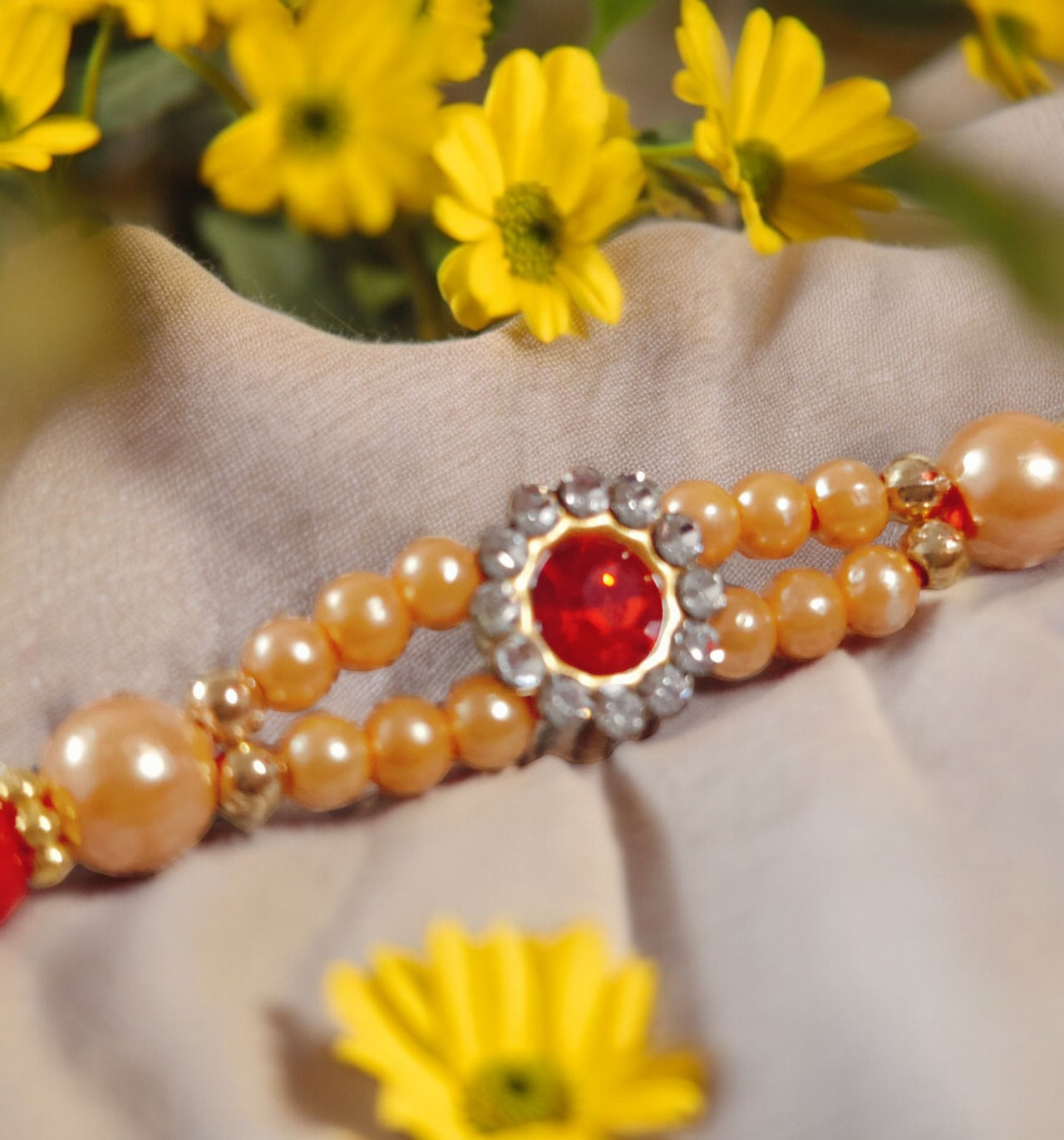 House Of Festivals Mauli Rakhi With Red Sparkling Stones & Moti