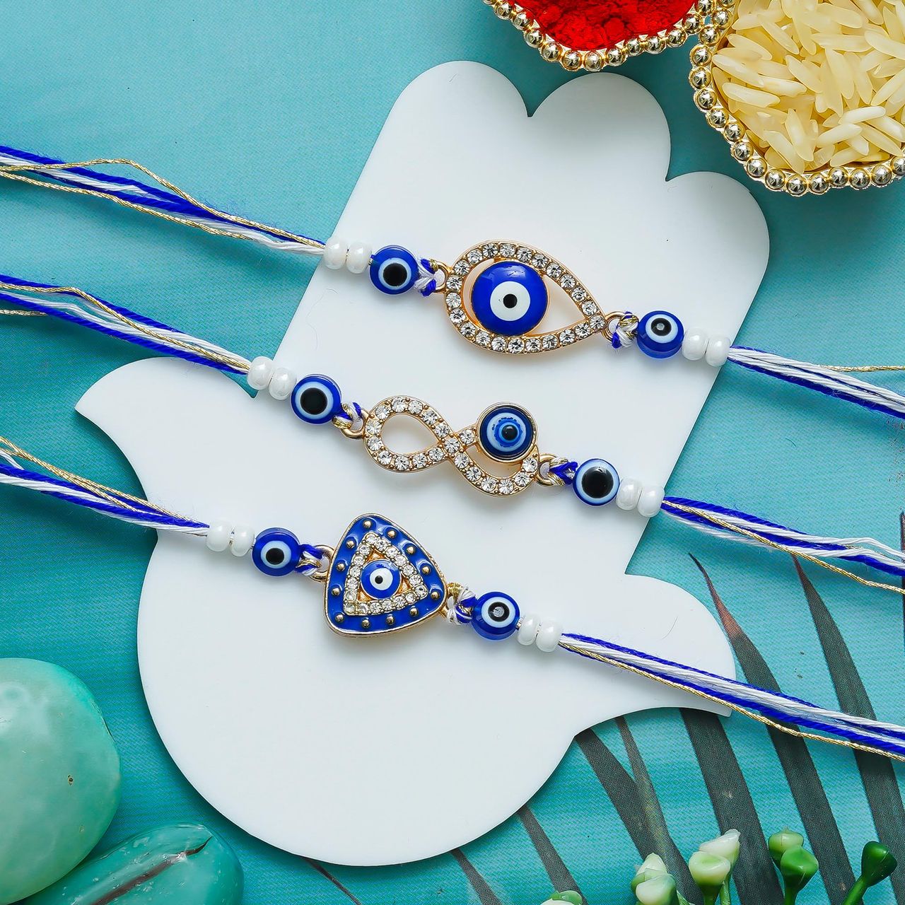 eCraftIndia Diamond Evil Eye Rakhis with Roli Chawal Pack