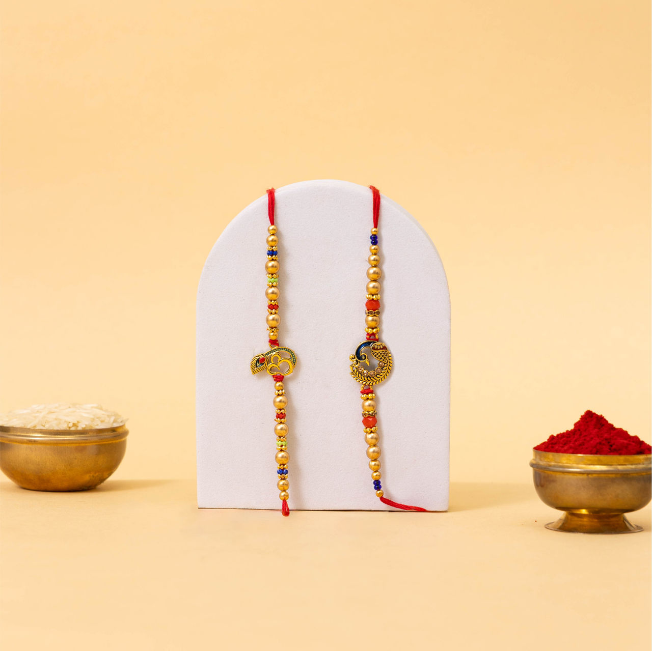 TIED RIBBONS OM and Peacock Rakhi for Brother with Roli Chawal