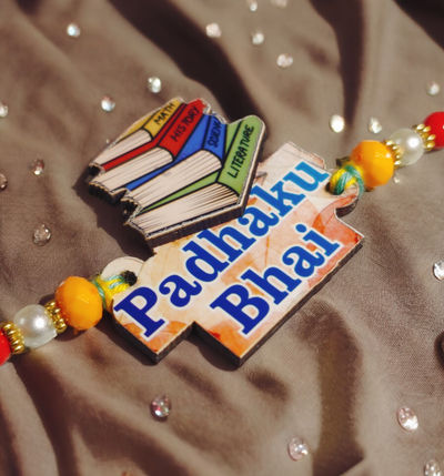 House Of Festivals Padhaku Bhai Wooden Pendant Rakhi With Moti