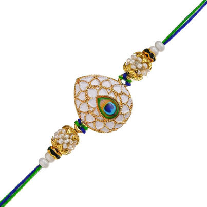Peacock Feather Pearls Designer Rakhi for Brother, Bhai, and Bhaiya with Roli Chawal Pack (eCraftIndia) Peacock Feather Pearls Designer Rakhi for Brother, Bhai, and Bhaiya with Roli Chawal Pack (eCraftIndia)